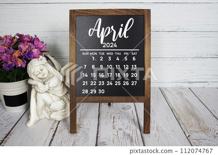 April 2024 monthly calendar with flower bouquet decoration on wooden background April 2024 monthly calendar with flower bouquet decoration on wooden background 112074767