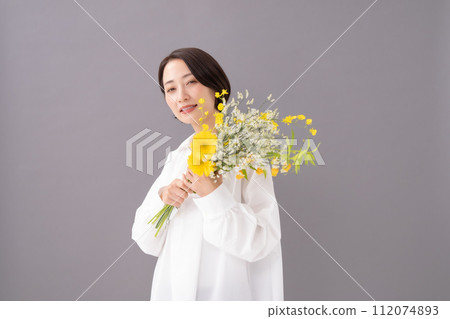 Woman with a bouquet of flowers beauty Woman with a bouquet of flowers beauty 112074893