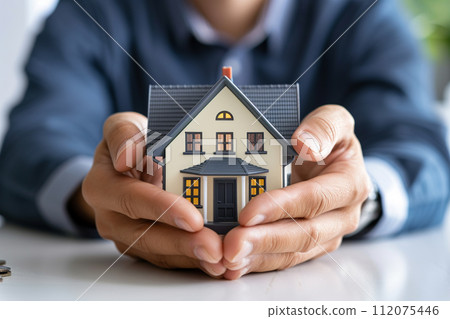 businessman with house model house insurance symbol bokeh style background with generative ai businessman with house model house insurance symbol bokeh style background with generative ai 112075446
