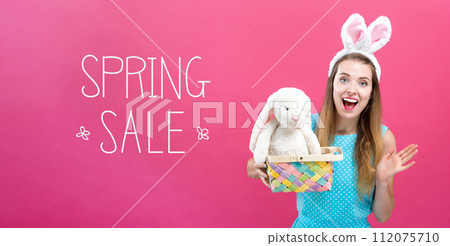 Spring sale message with woman with Easter basket 112075710