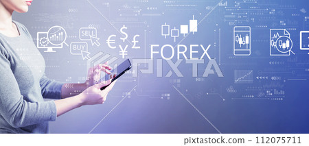 Forex trading concept with woman using a tablet 112075711