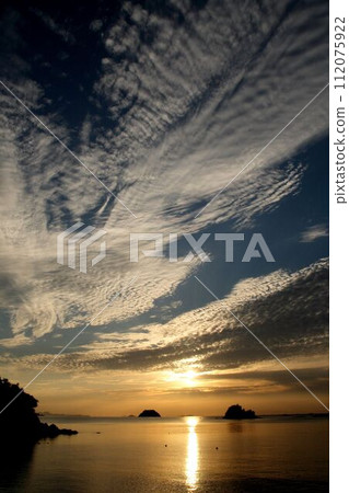 Sunset and clouds at Imabari Kamoike coast 112075922