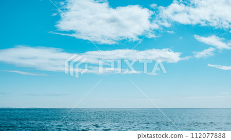 simple blue sky, sea and horizon 112077888