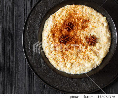rizogalo, creamy greek rice pudding in a bowl rizogalo, creamy greek rice pudding in a bowl 112078576