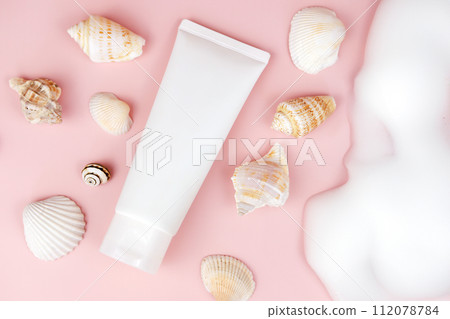 cosmetic moisturizer cream tube bottle, soap foam, bubbles, seashells on pink background. bath foam, shampoo shower gel, moisturizer lotion. face body cleanser. Cosmetic skincare product blank package cosmetic moisturizer cream tube bottle, soap foam, bubbles, seashells on pink background. bath foam, shampoo shower gel, moisturizer lotion. face body cleanser. Cosmetic skincare product blank package 112078784
