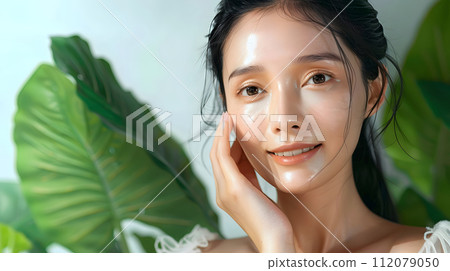 Illustration of a close-up photo of a beautiful young woman's face with good skin posing as a model selling skin care cosmetics. Can be used as an idea for models to pose for advertising shoots. 112079050