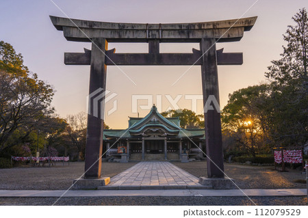 Osaka Castle Toyokuni Shrine bathed in the morning sun, the main shrine seen from the Nino Torii gate Osaka Castle Toyokuni Shrine bathed in the morning sun, the main shrine seen from the Nino Torii gate 112079529