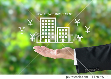Businessperson's hands and real estate investment image 112079708