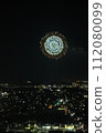fireworks floating over the city 112080099