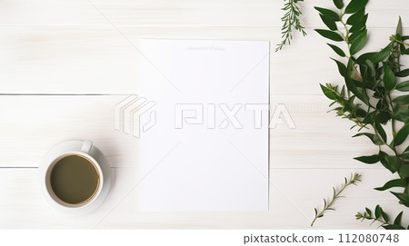 A Cup of Coffee Next to a Blank Paper A Cup of Coffee Next to a Blank Paper 112080748