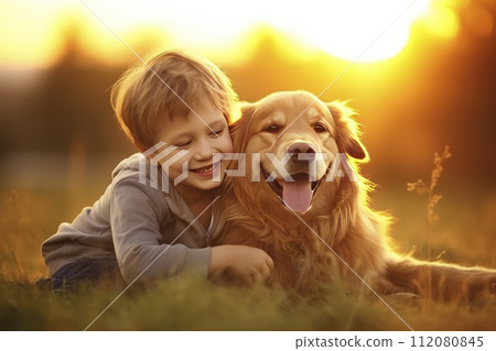 Boy and Dog Laying in the Grass on a Sunny Day 112080845