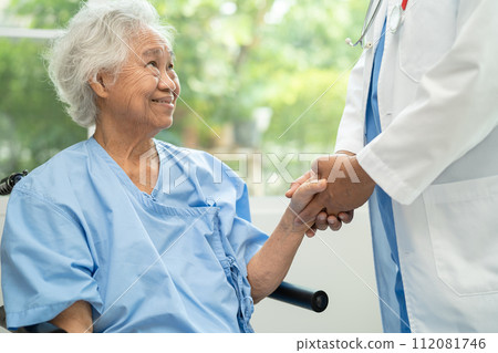 Doctor help and care Asian senior woman on wheelchair at hospital. 112081746