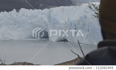 Unidentified Tourist Admiring the Majestic Perito Moreno Glacier 112082948