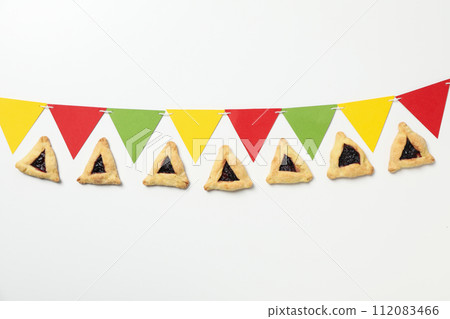 A mask with traditional cookies for the day of Purim. A mask with traditional cookies for the day of Purim. 112083466