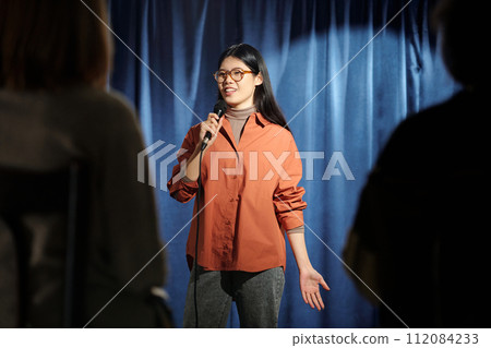 Woman performing in front of audience 112084233