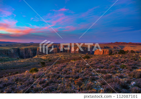 Sunset over Dead Indian Canyon in Arizona with vibrant sky and rugged cliffs Sunset over Dead Indian Canyon in Arizona with vibrant sky and rugged cliffs 112087101