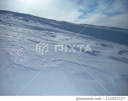 snow-covered slope snow-covered slope 112087327