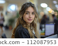 beautiful young woman in the office with her computer 112087953