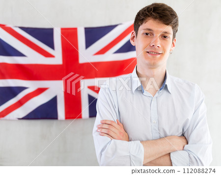 Young guy posing in front of UK flag Young guy posing in front of UK flag 112088274