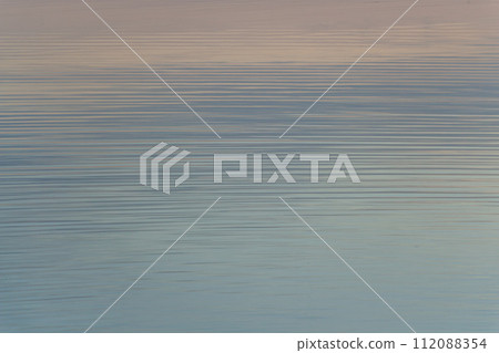 calm water surface in pastel colors at sunset, calming photo calm water surface in pastel colors at sunset, calming photo 112088354