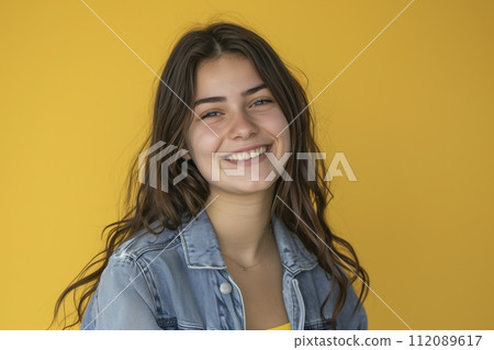 happy teen girl. Dressed in a cowboy jacket. Yellow background happy teen girl. Dressed in a cowboy jacket. Yellow background 112089617