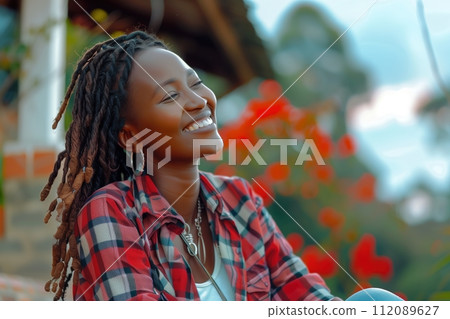 African woman with dreadlocks in her hair smiling and happy African woman with dreadlocks in her hair smiling and happy 112089627