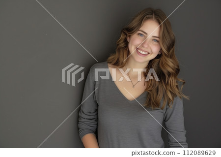 beautiful and smiling young woman with long brown hair beautiful and smiling young woman with long brown hair 112089629