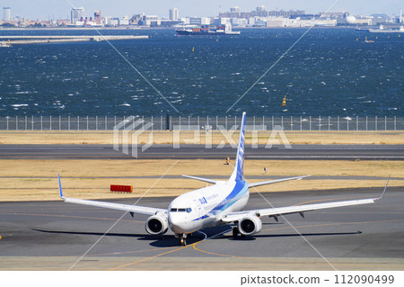 Scenery of Haneda Airport, airplane taxiing, Ota Ward, Tokyo 112090499