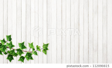 white wooden planks and leaves 112090815