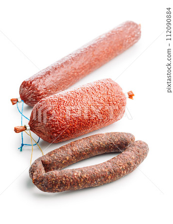 Smoked salami sausages isolated on white background. Smoked salami sausages isolated on white background. 112090884