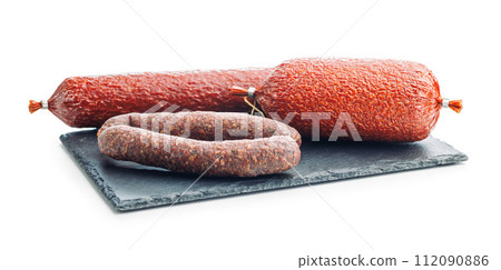 Smoked salami sausages isolated on white background. 112090886