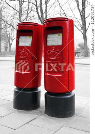 Color isolated modern red English pillar boxes Color isolated modern red English pillar boxes 112091784