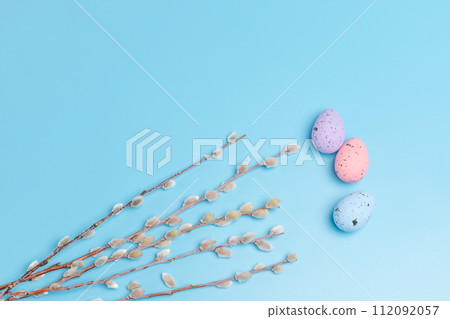 Colored Easter eggs on the blue background. Colored Easter eggs on the blue background. 112092057