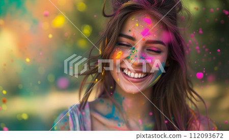 Cheerful young woman covered in rainbow powders celebrating holi festival Cheerful young woman covered in rainbow powders celebrating holi festival 112093672