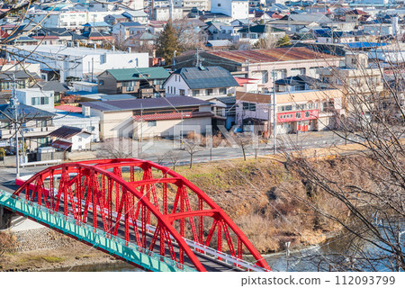 Kamaguchi Bridge spanning the Tenryu River and the cityscape of Okaya City 112093799