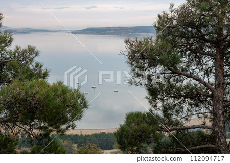 Tbilisi sea, reservoir and boats with deflated sails Tbilisi sea, reservoir and boats with deflated sails 112094717