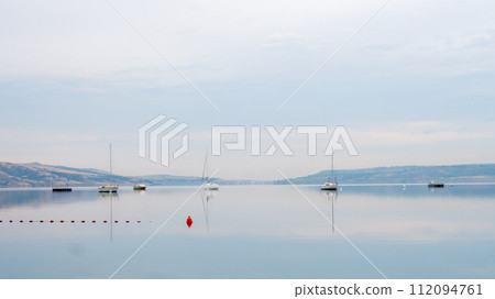 Tbilisi sea, reservoir and boats with deflated sails 112094761