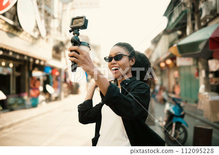 Asian woman enjoy travel in  downtown district 112095228