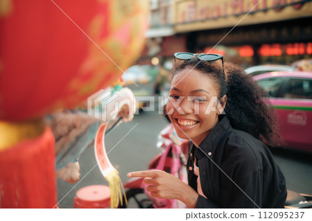 Asian woman enjoy travel in  downtown district 112095237
