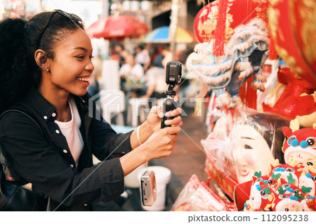 Asian woman enjoy travel in  downtown district 112095238