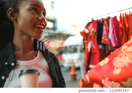 Asian woman enjoy travel in  downtown district 112095247