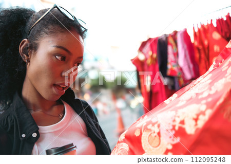 Asian woman enjoy travel in  downtown district 112095248