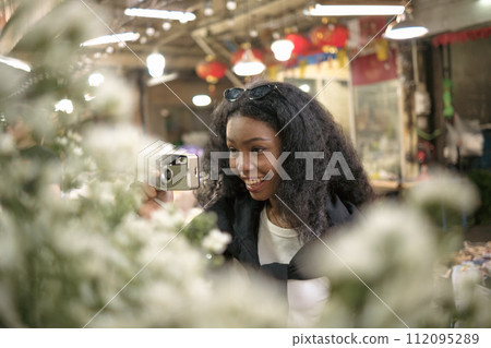 Asian woman enjoy travel in  downtown district 112095289