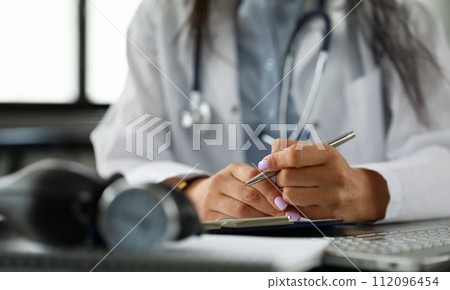 Arms of GP writing with silver pen document Arms of GP writing with silver pen document 112096454
