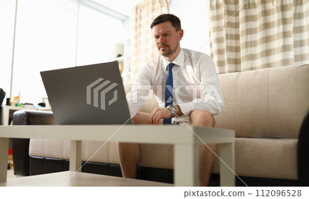 Concentrated man using pc Concentrated man using pc 112096528