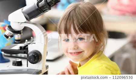 Girl in yellow shirt 112096530