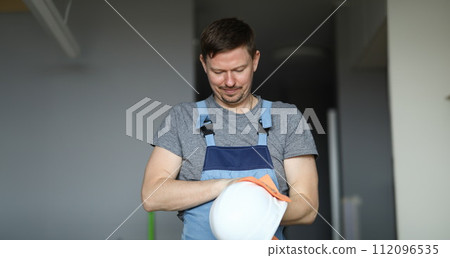Concentrated male worker indoors Concentrated male worker indoors 112096535