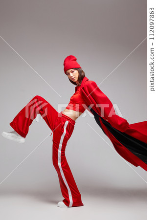 Fashion asian female model in red coat. 112097863