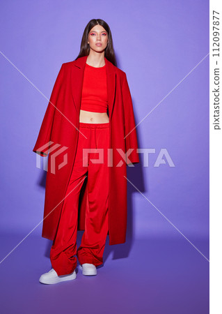 Fashion asian female model in red coat. 112097877