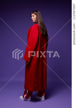 Fashion asian female model in red coat. 112097887